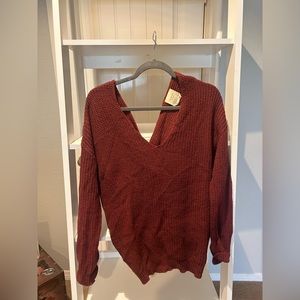 Maroon sweater with a style design on back s